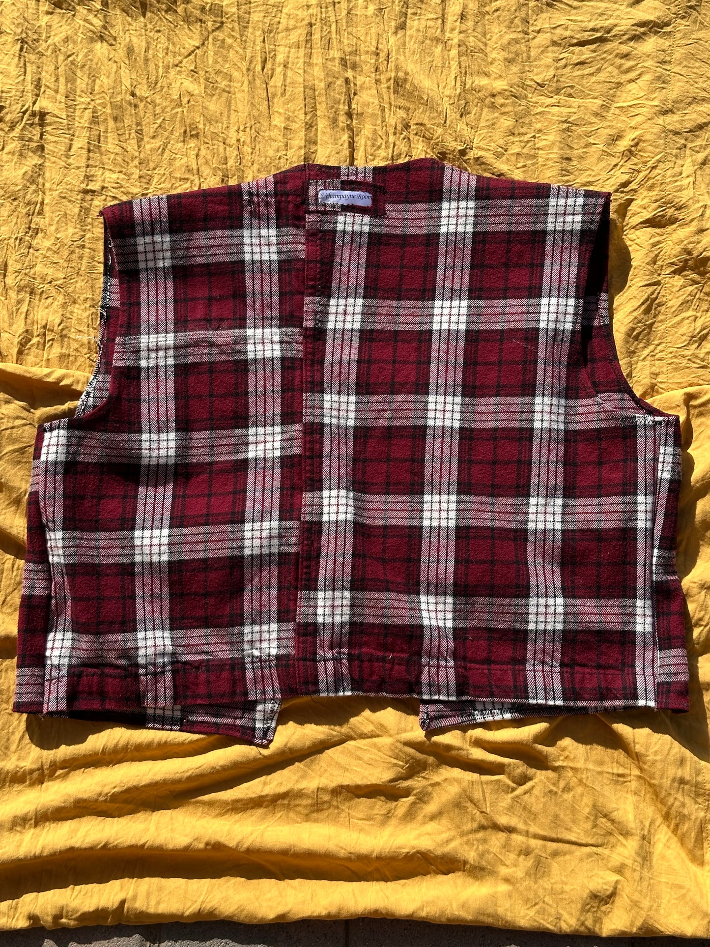 “As if” it’s Plaid vest