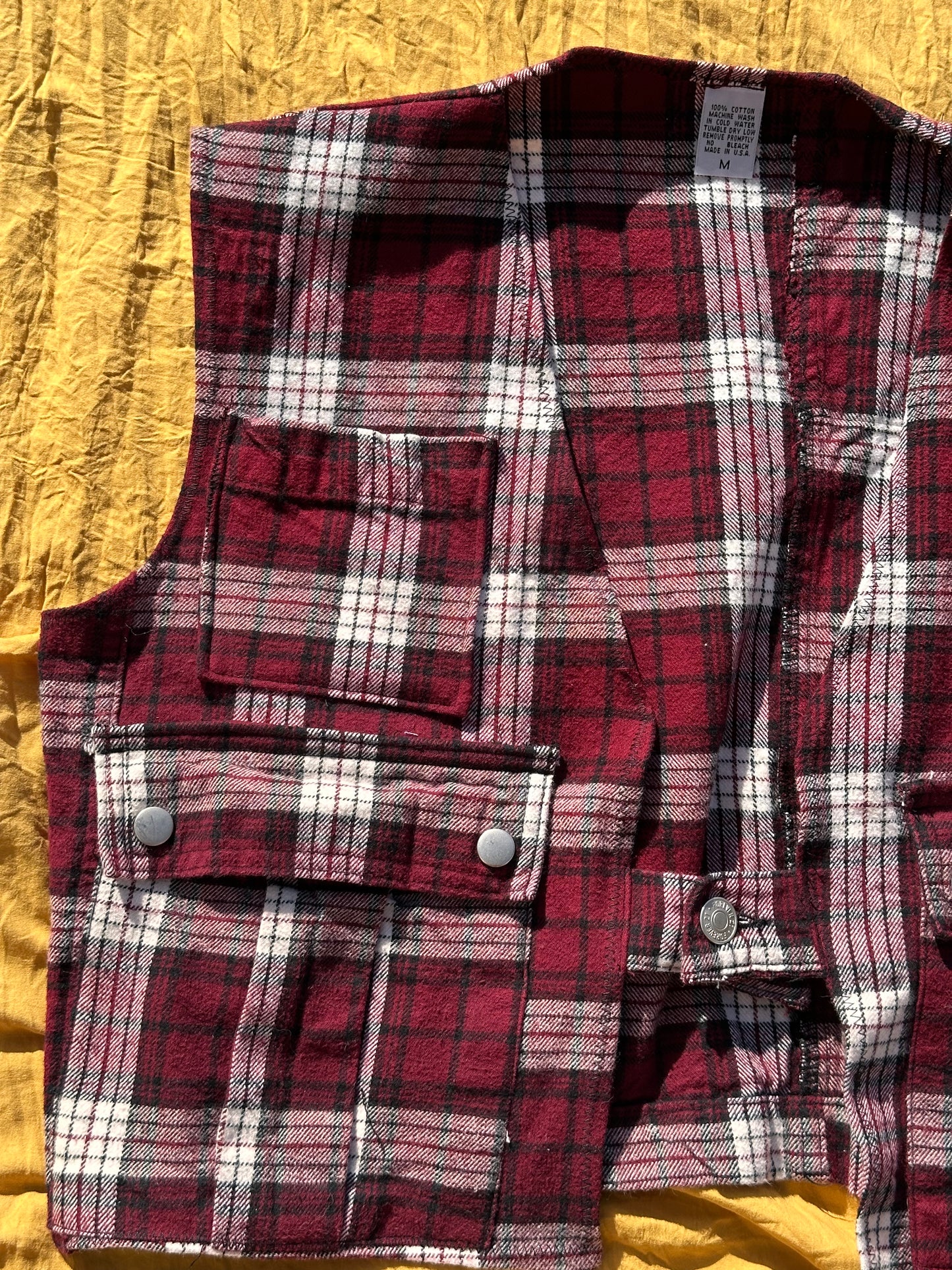 “As if” it’s Plaid vest